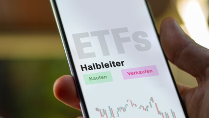 December 2022. An investor analyzes the semiconductor ETF fund on phone screen Halbleiter-ETFs. German text translated :Kaufen, Verkaufen, Halbleiter= buy, Sell, semi-conductor