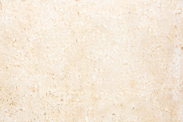 Embossed beige stone texture. Natural material as background.