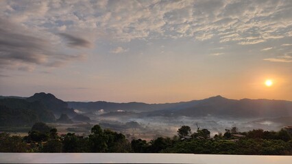 Beautiful bird's-eye view of the sea of mist in the green mountain forest, Phu Chee Fah, Thoeng District, Chiang Rai, Thailand.