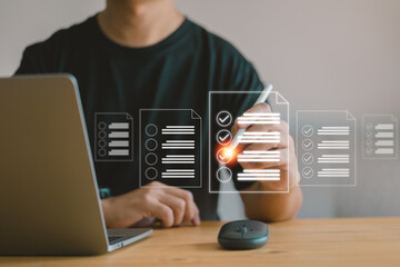 business concept and smart checklist on a virtual screen, In a modern office, a man uses a pen to...