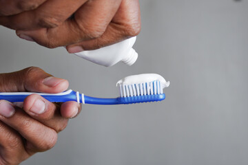 Fototapeta na wymiar hand holding tooth brush with paste