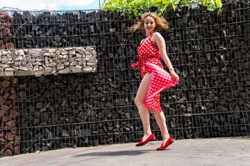 girl in a red dress in white polka dots