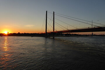 Fototapeta na wymiar Sunset at the Kniebridge in Dusseldorf on the Rhine Germany