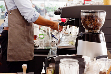 coffee shop staff using coffee machine coffee shop concept.