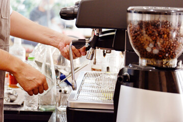 coffee shop staff using coffee machine coffee shop concept.