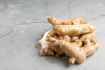 Organic fresh ginger root on the table.