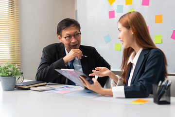 Business partnership concept, Businesswoman pointing at document during senior consultation