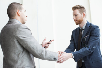 Businesspeople shaking hands after agreement