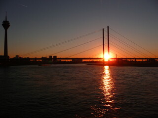 Sunset behind the Kniebridge in Dusseldorf on the Rhine Germany