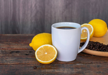 Obraz na płótnie Canvas Lemon black coffee in white cup.