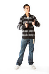 Fototapeta premium Teenage Students: Confident Boy. A positive thumbs up and a confident expression from a smiling Indian teenage pupil. From a series of related images.