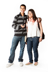 Teenage Students: Good Friends. Happy smiles from a pair of late teenage Indian school friends isolated on white. From a series of related images.