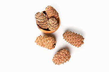 Cedar cones in wooden plate . Healthy food and diet food. Natural product.