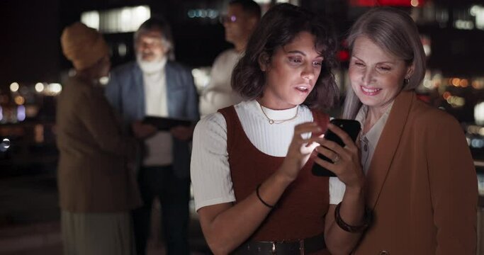Business woman, phone and talking on night at balcony for appl planning, web search or online networking. Teamwork, late deadline discussion and digital tech smartphone collaboration on city rooftop