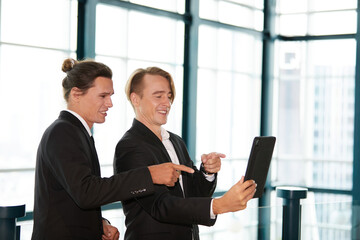 businessman or partner working on tablet and video call with customer in the office