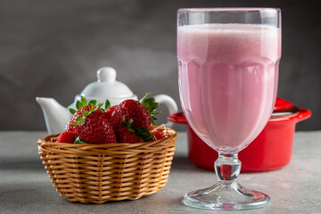 Glass with tasty strawberry smoothie.