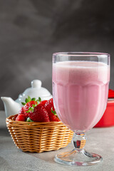 Glass with tasty strawberry smoothie.