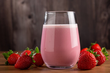 Glass with tasty strawberry smoothie.