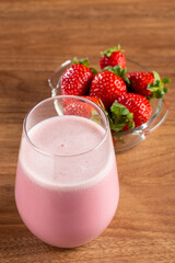 Glass with tasty strawberry smoothie.