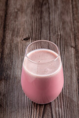 Glass with tasty strawberry smoothie.