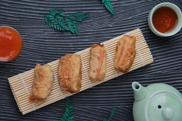 Dimsum, as the name Keicak, is filled with carrots, chicken, mushrooms and wrapped in tofu skin, top view angle