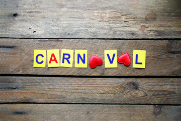 Carnival idea multi-colored letters lie on the table