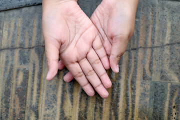 Closeup of children wrinkled wet skin hands after swimming