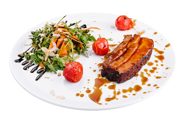 Tasty pork rib baked under sauce on plate