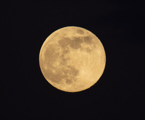 The first full moon of the year rises in the sky, its bright, round face casting a silvery glow...