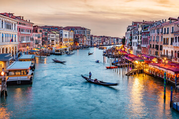 Fototapeta na wymiar Grand Canal in Venice, Italy at sunset with gondolas