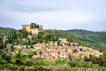 Fototapeta na wymiar Village of Castelnou or Castellnou dels Aspres, a small town and French commune, located in the department of Pyrénées-Orientales, region of Occitanie and historical region of Roussillon.