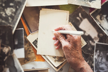 Old hand of grandmother with her memories