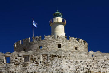 The lighthouse on the island of Rhodes and the fortification next to it, Greece. 