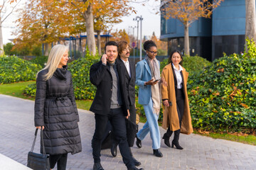 Multi-ethnic business people, business park, coworkers, walking to work