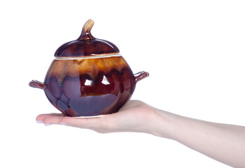 Ceramic baking pot in hand on white background isolation