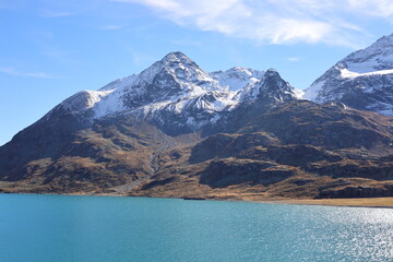 Fototapeta premium View on the Bianco Lake which is a reservoir at the Bernina pass in the Swiss canton of Graubünden