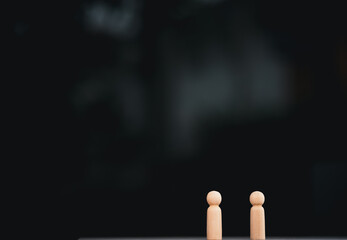 Concept of Human resource, Talent management,  Recruitment employee. Many wooden human figures, Man and woman standing.