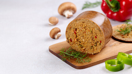 Mushroom based vegan sausage with vegetables and spices on wooden board, top view - obrazy, fototapety, plakaty