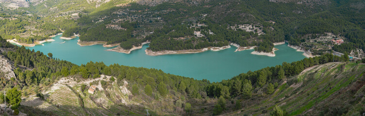 Fototapeta premium Panoramic view of the Guadalest reservoir from above in the town's viewpoint. Autonomous community of Valencia, Alicante, Spain.