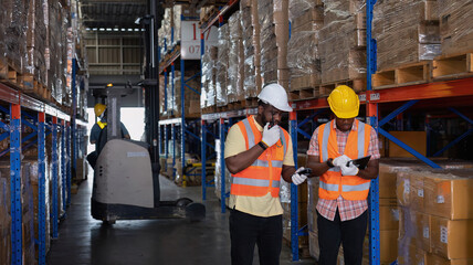 Worker in depot storage warehouse use tablet pc check scan barcode goods box and store on shelf