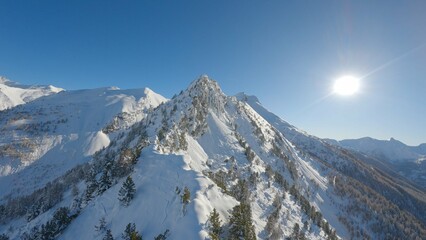 Aerial view of an Alpine massif covered in fresh snow