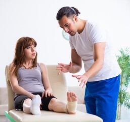 Leg injured woman visiting young doctor traumatologist