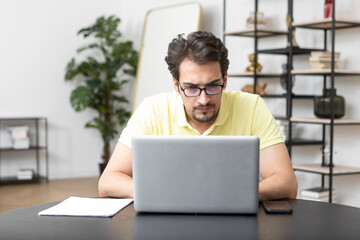 Young man disappointed after online courses. Unsatisfied of distance learning and stressful education concept	