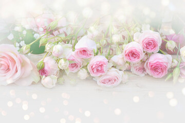 Beautiful bouquet with pink roses and bokeh lights - mother's day, birthday, wedding - greeting card with copy space