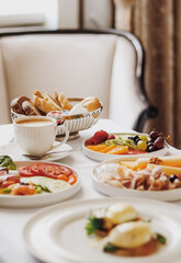 Luxury hotel and five star room service, various food platters, bread and coffee as in-room...