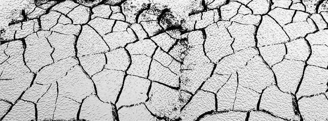 Close up of crack soil and muddy in the dry season textures, hot summer. Patterns and texture cracked soil of sunny dried earth soil, Drought of the ground. Dried cracked earth soil ground background