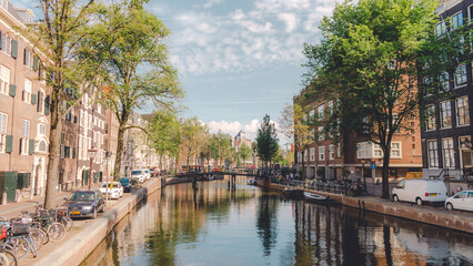 Obraz premium Views of a canal with reflections in the water from Amsterdam, Netherlands