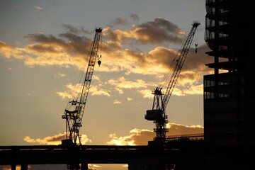 Construction crane and sunset