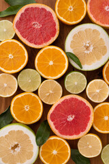 Fototapeta na wymiar Citrus background with limes, lemons, grapefruits and oranges