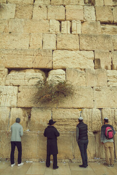 Jewish men praying at the sacred Wailing Wall, Western Wall, Jerusalem